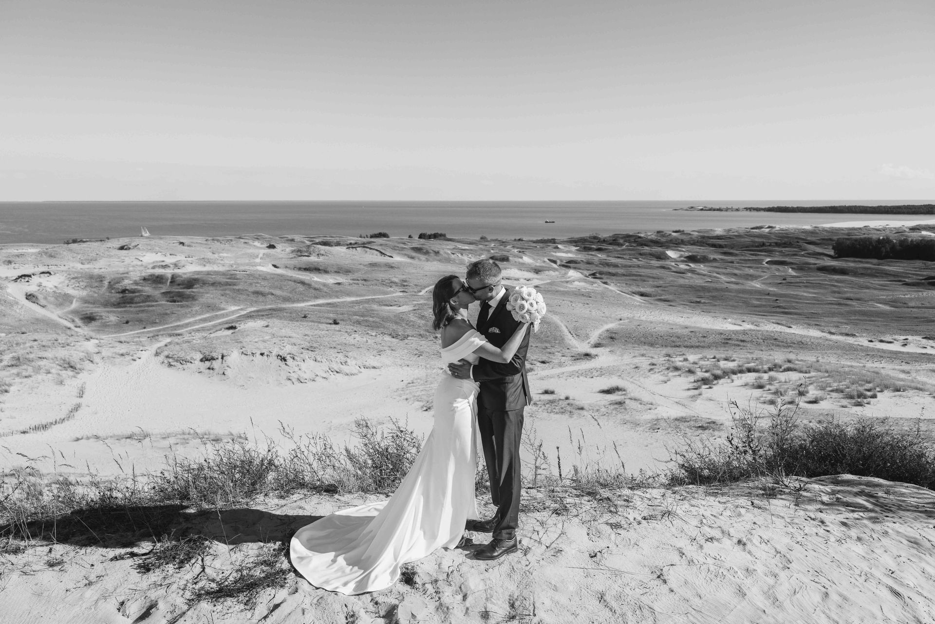 Couple kissing in the Nida dunes