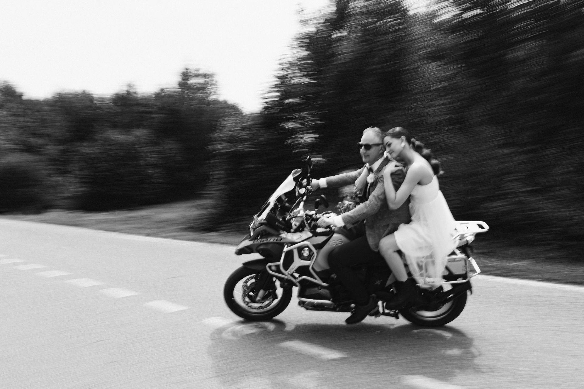 Young wedding couple riding motorcycle